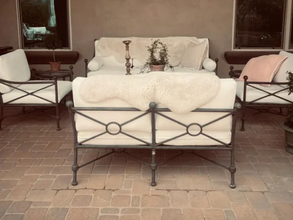 Cozy outdoor seating area with plants.