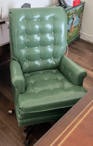 Green leather office chair with buttons